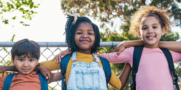 kids along a fence